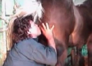 Curly-haired MILF fisting horse pussy