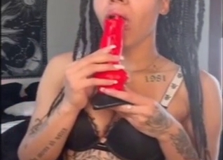 Hot zoo XXX: a black girl sucking a fake cock