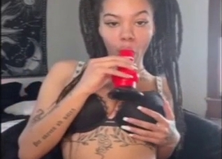 Hot zoo XXX: a black girl sucking a fake cock